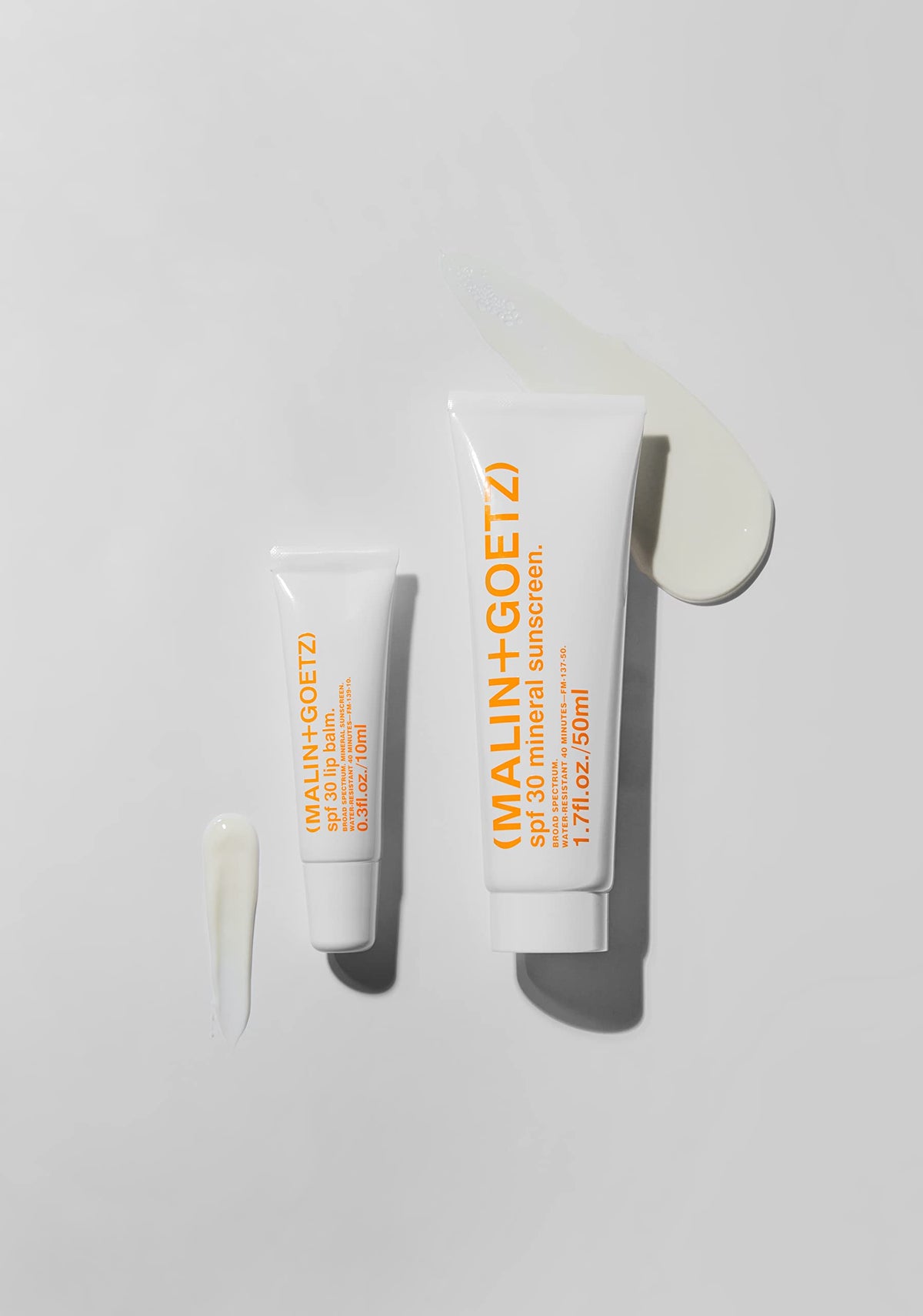 MALIN+GOETZ packaging label highlighting PCR recycled plastic and eco-friendly benefit