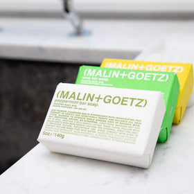 Malin + Goetz bar soap in shower lifestyle, gentle lathering for hydrated skin