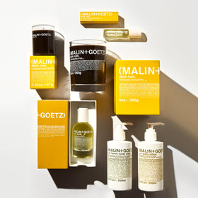 MALIN+GOETZ in bathroom lifestyle setting showing layering with cleansers