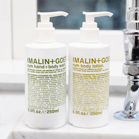 MALIN+GOETZ lotion being poured on hand for immediate hydration demonstration