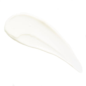 MALIN+GOETZ styling cream held in hand to show travel size and easy portability