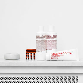 MALIN+GOETZ applied to wet hair reducing frizz and speeding styling