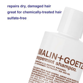 MALIN+GOETZ bottle beside ruler showing 8 fl oz scale and travel-friendly size benefit