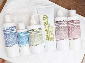 MALIN+GOETZ on bathroom shelf in lifestyle setting for daily routine inspiration