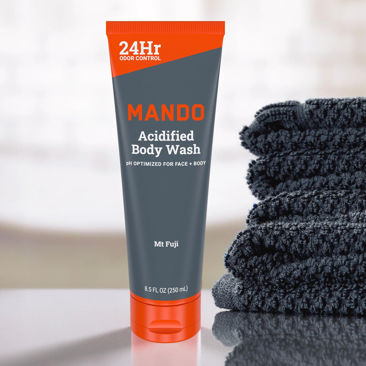 Mando size comparison beside toiletries showing travel-friendly 8.5 oz