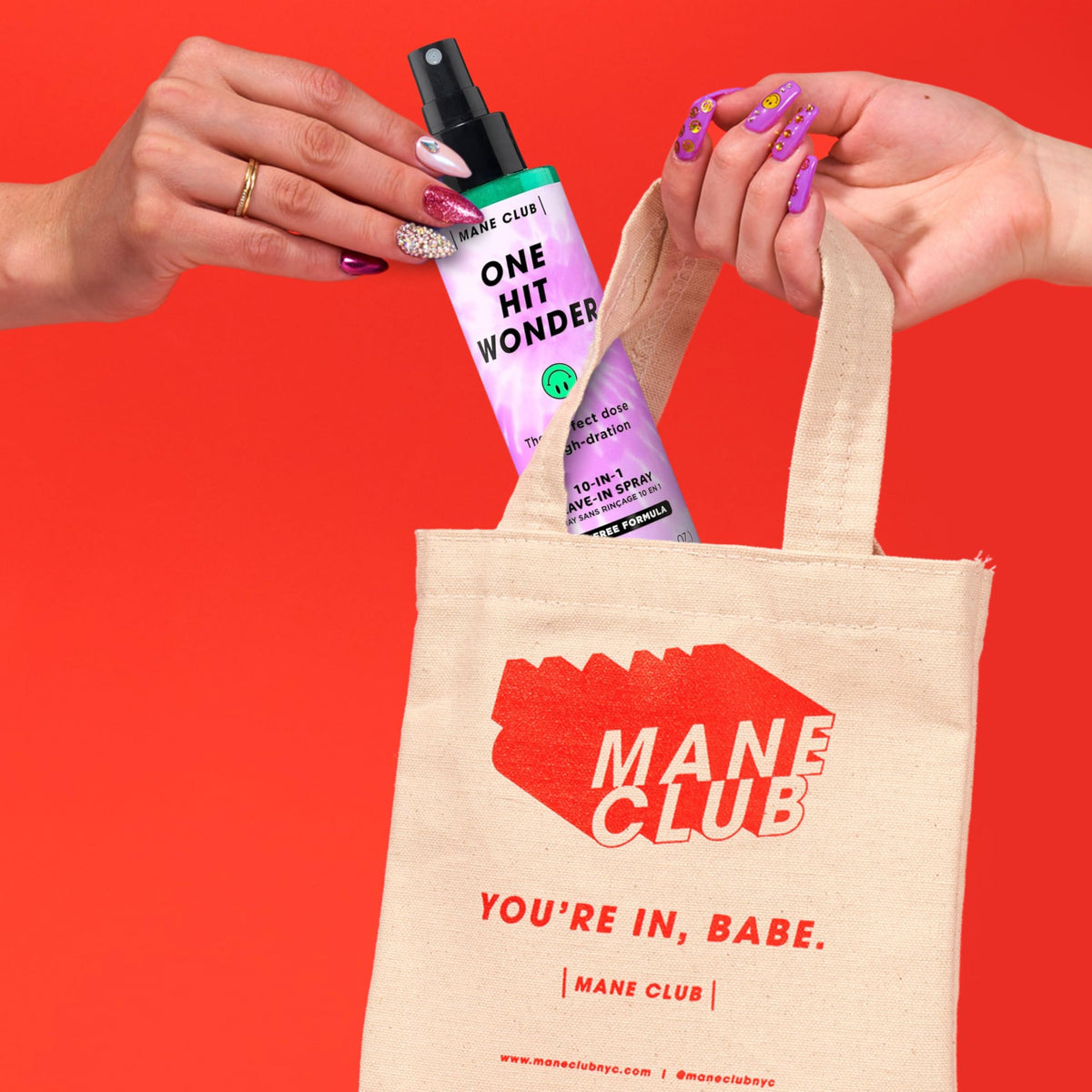 MANE CLUB bottle held in hand to show 5.3 oz scale and travel-friendly size