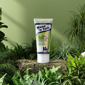 Mane 'n Tail Herbal Gro 5.5 oz bottle in hand indicating portable size