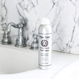 Mane Tame spray action on hair creating instant texture and lift