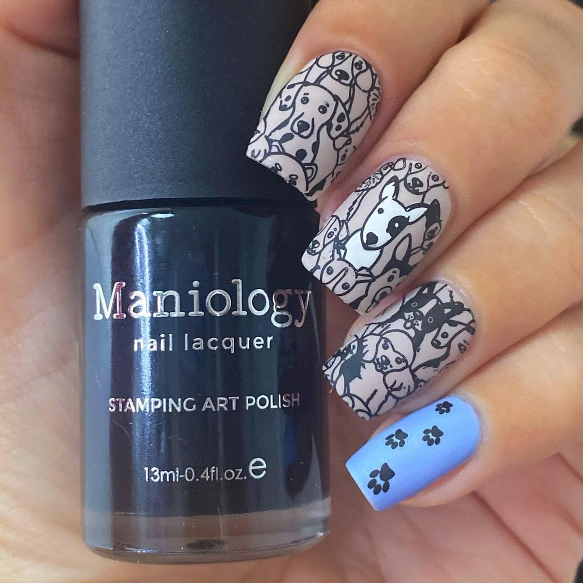 Nail artist using Maniology polish to stamp a floral design showing precision