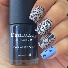 Nail artist using Maniology polish to stamp a floral design showing precision