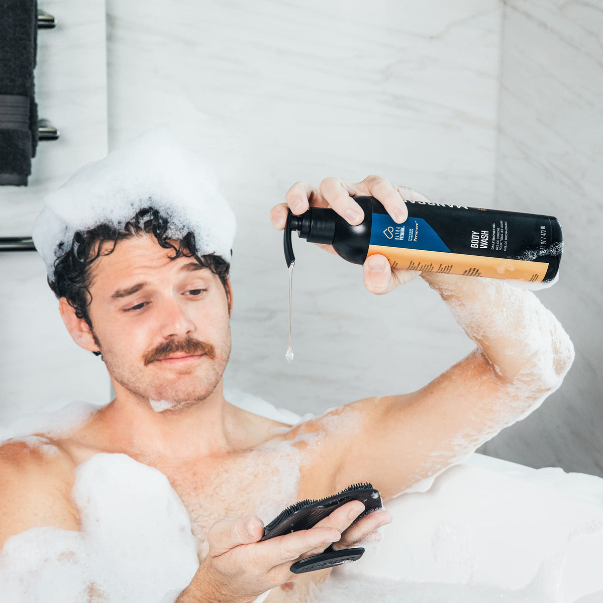 MANSCAPED Persevere next to a 16 oz reference object, illustrating true bottle scale
