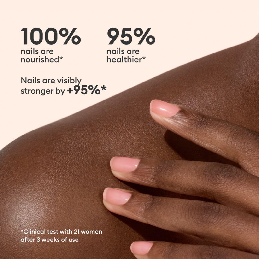 Manucurist Active Glow Cranberry applied on nails in a casual lifestyle setting showing wearable coral tint benefit: natural glow
