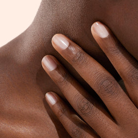 Manucurist brush applying polish stroke demonstrating smooth even coverage