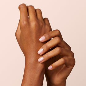 Manucurist swatch on wrist illustrating Hortencia sheer pale pink and natural look benefit