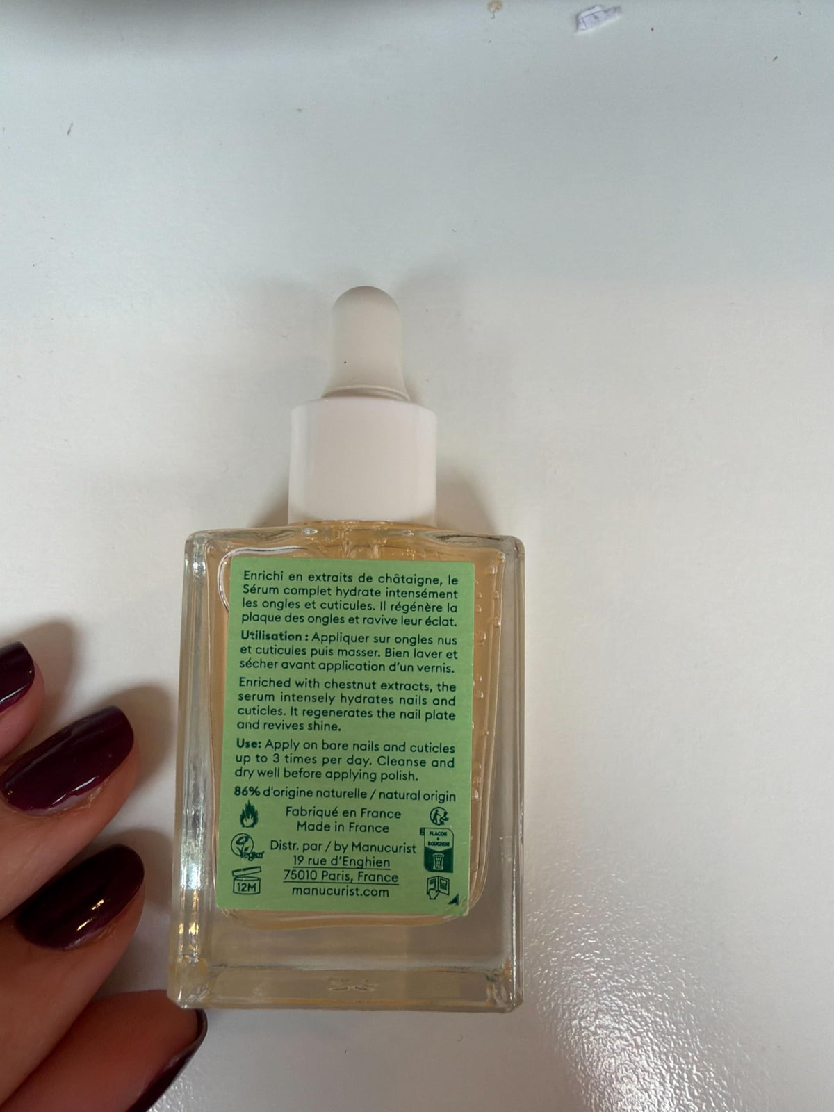 Botanical oils and chestnut extract flatlay with Manucurist branding