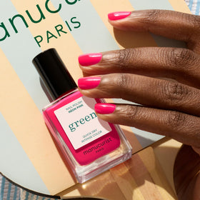 Manucurist neon pink swatch on fingers showcasing opaque, vibrant finish