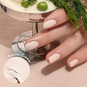 Manucurist brush stroke showing glossy off‑white coverage and smooth application