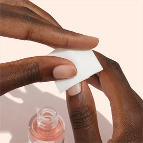 Manucurist bottle held in hand showing compact 1 fl oz travel-friendly size