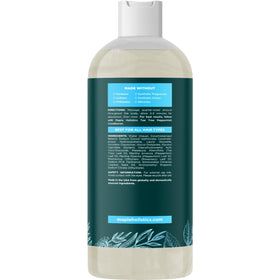 Maple Holistics bottle beside fresh rosemary and peppermint indicating botanical freshness