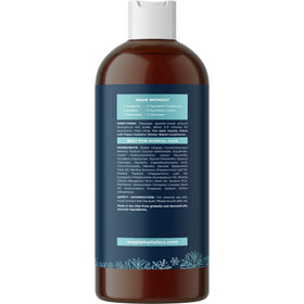 Maple Holistics bottle next to a hand for size and scale clarity benefit
