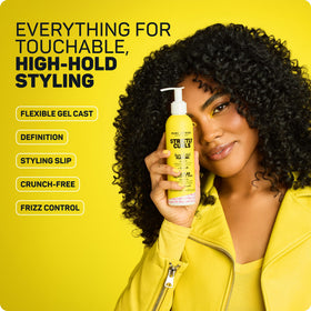 Marc Anthony product being scrunched into wet curls to define and reduce frizz