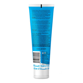 Marc Anthony conditioner on bathroom shelf in natural styling scene