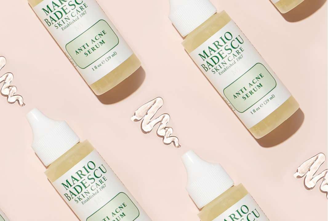 Mario Badescu bottle on bathroom shelf with towel, convenient nightly skincare routine visual