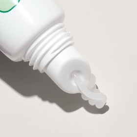 Mario Badescu balm applied to lips in lifestyle shot showing smooth finish benefit