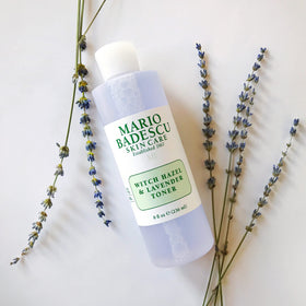 Mario Badescu bottle beside aloe leaves showing soothing ingredients