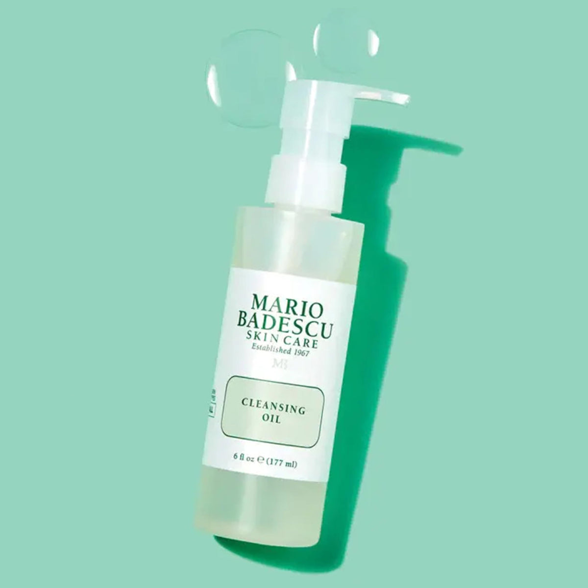 Mario Badescu cleansing oil clear droplet texture demonstrating lightweight, non-greasy feel