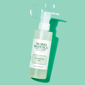Mario Badescu cleansing oil clear droplet texture demonstrating lightweight, non-greasy feel