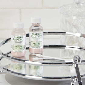 Mario Badescu bottle on bathroom shelf signaling ritual-ready skincare