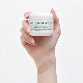 Mario Badescu 2 oz jar next to a ruler for honest size and portability