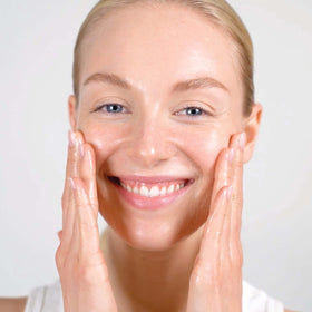 Mario Badescu pump in hand demonstrating easy dispensing and control