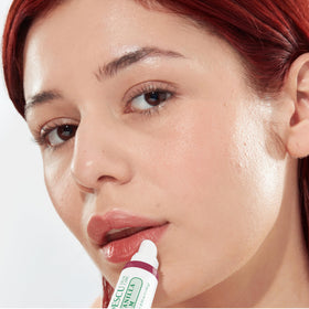 Mario Badescu coconut lip balm applied to lips for immediate hydration and smooth finish