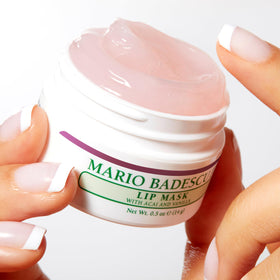 Mario Badescu lip mask held beside coin for size comparison and portability