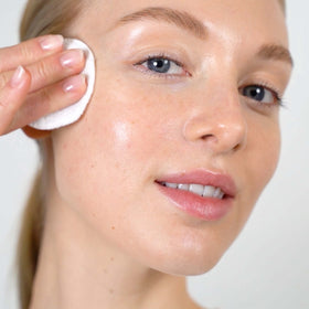 Mario Badescu pouring toner texture demonstrating lightweight, non-drying feel