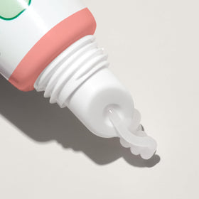 Mario Badescu next to a coin to show size and convenient portability for on-the-go use