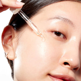 Mario Badescu applying serum to neck and décolletage demonstrating targeted smoothing benefit
