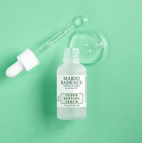 Mario Badescu pipette dispensing serum drops for precise, mess-free application and control