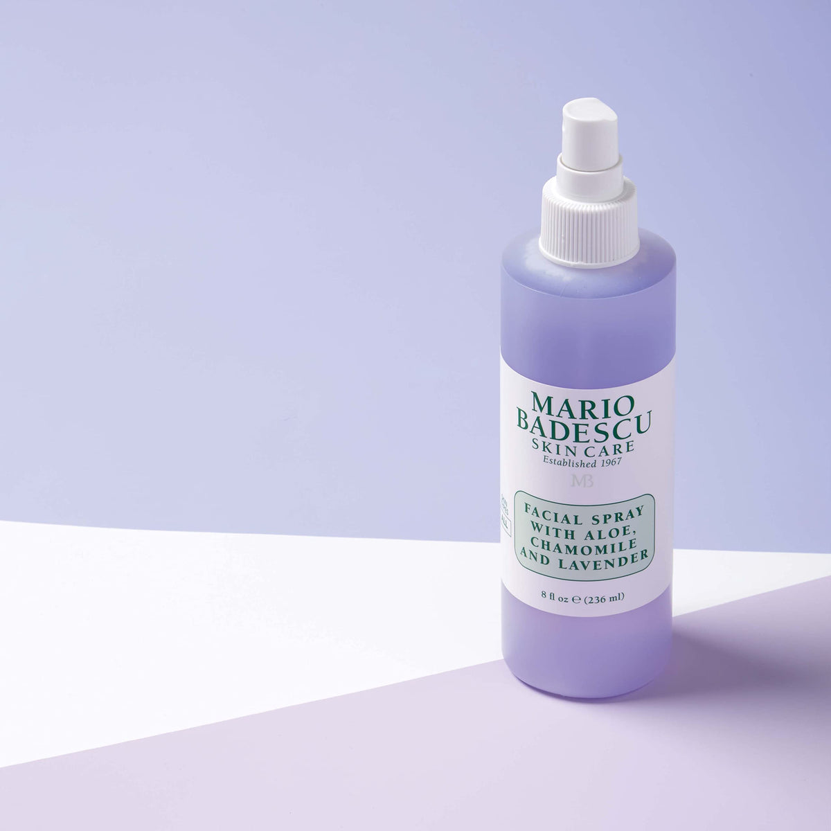 Mario Badescu mist over model's face showing post-makeup dewy finish and brightening effect