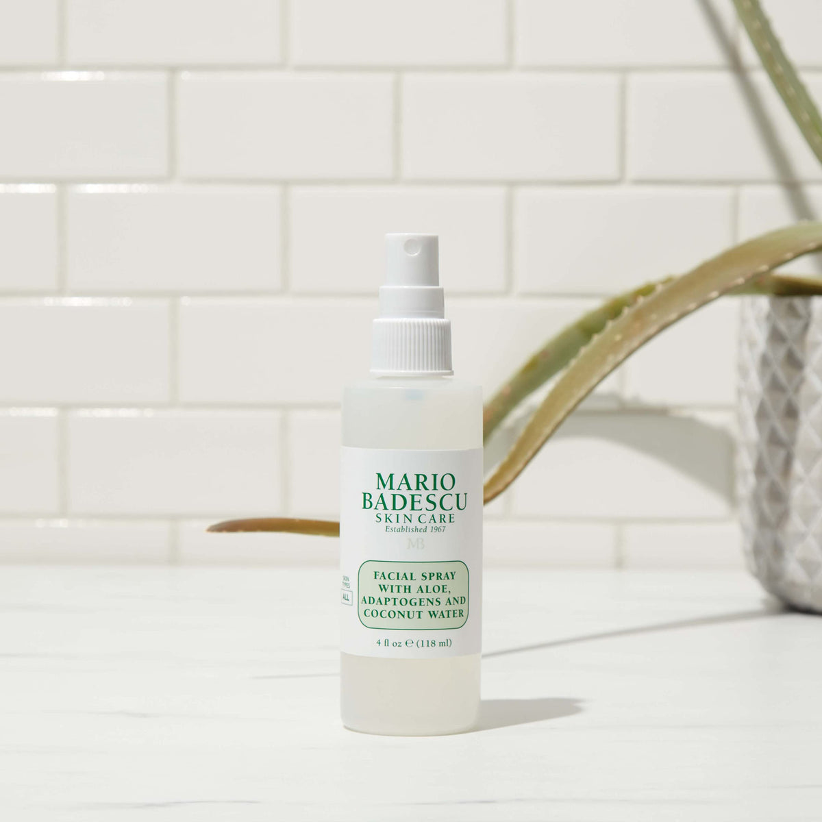Mario Badescu spray applied over makeup delivering a radiant set and glow