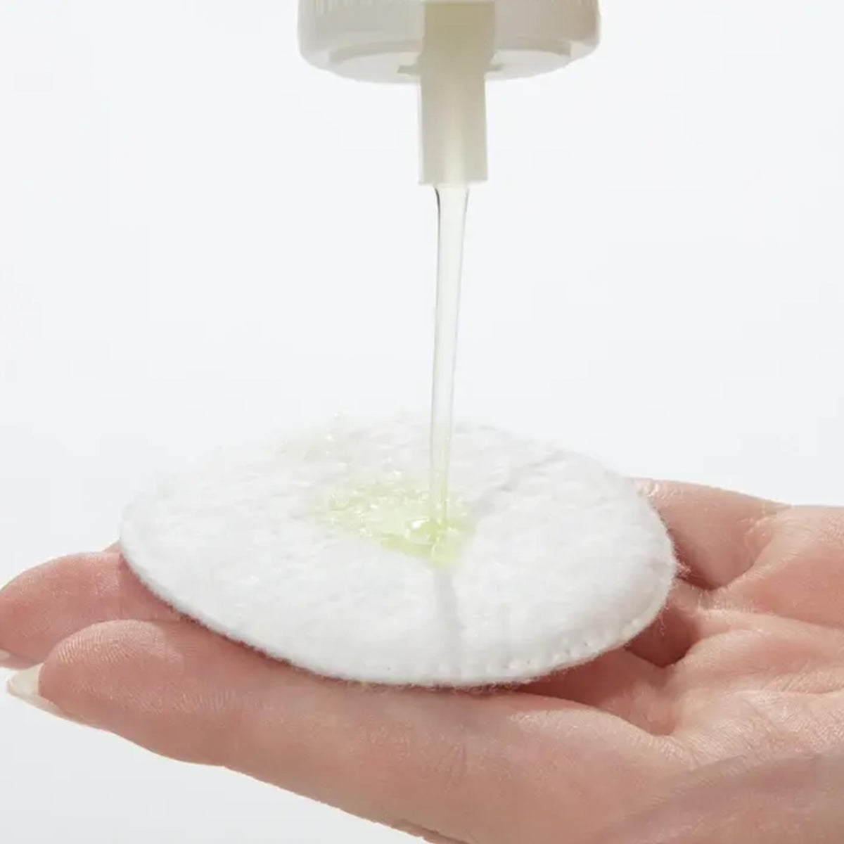 Mario Badescu bottle in hand showing 8 fl oz size for scale