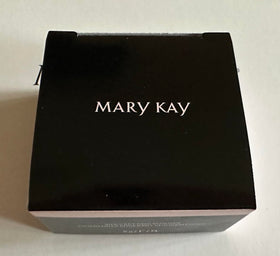 Mary Kay powder being applied with brush for smooth, natural setting