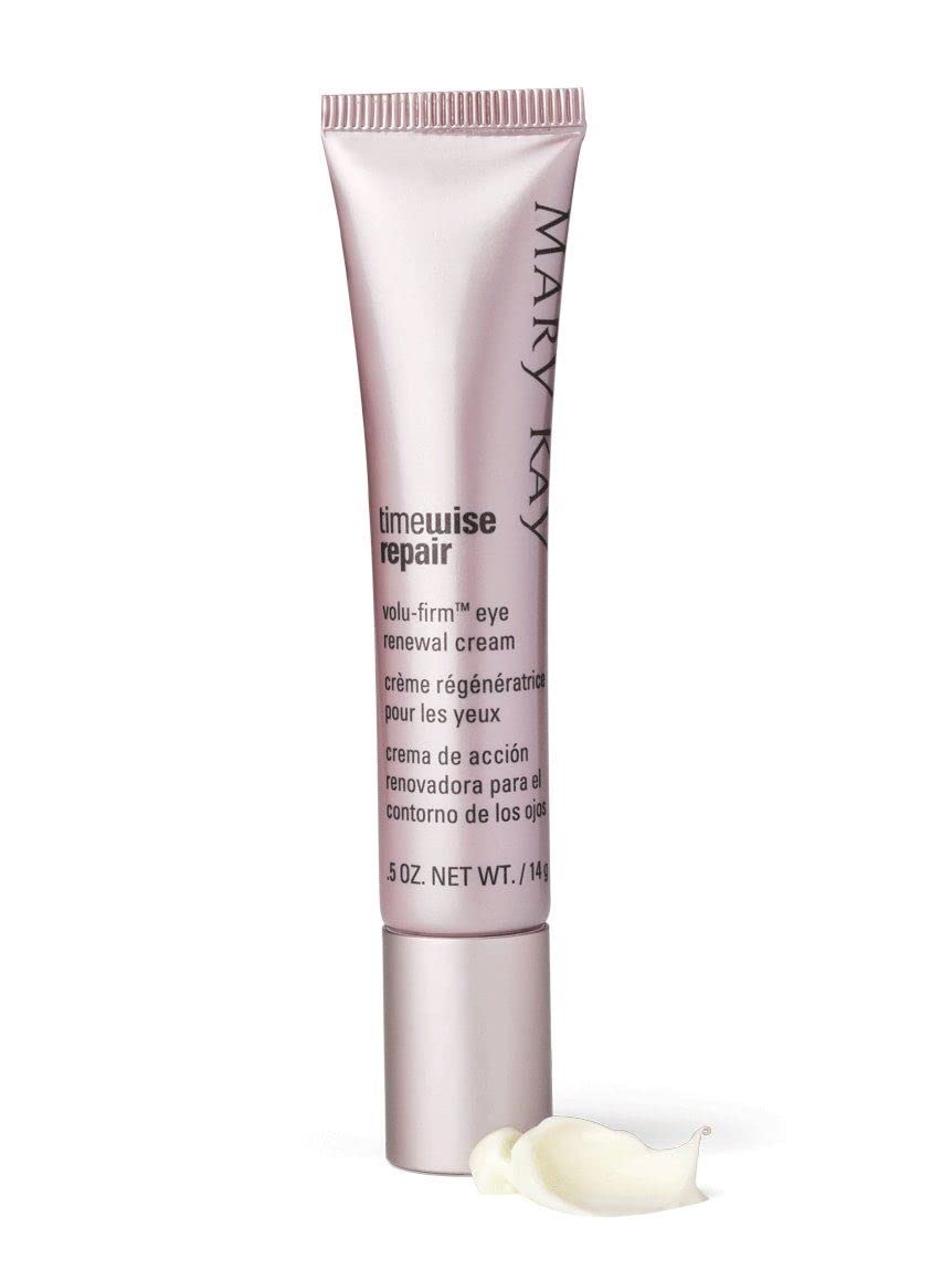 Mary Kay eye cream beside coin for scale showing compact travel size
