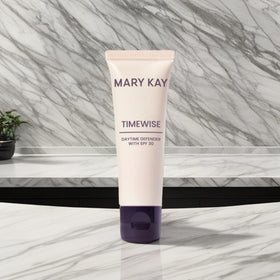 Mary Kay Timewise next to a coin for size comparison and travel convenience