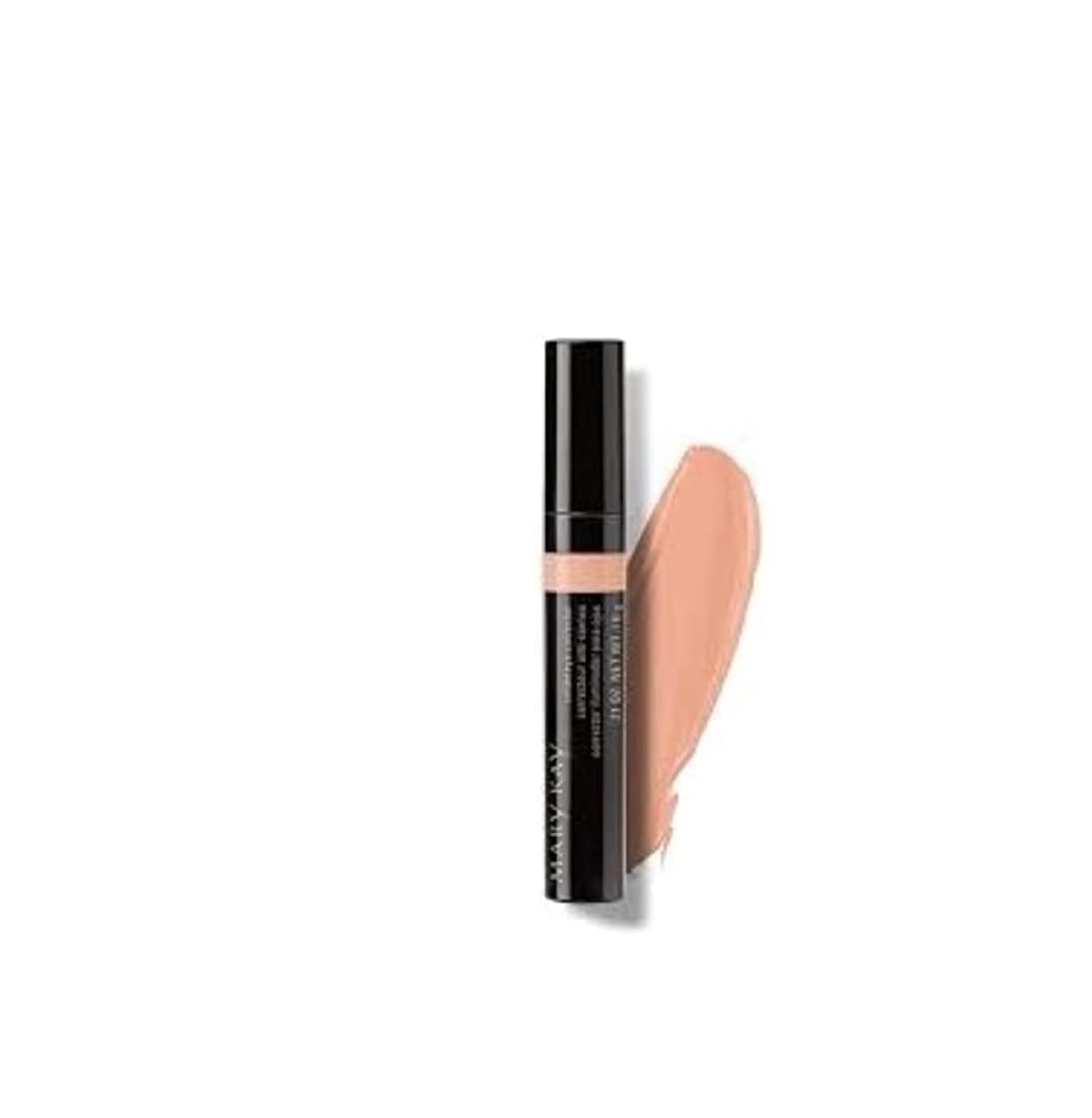 Model applying Mary Kay corrector under eye showing natural coverage and quick application