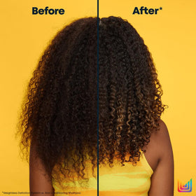 MATRIX mask being applied to damp curls for frizz control