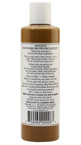 Maui Babe bottle in beach setting evoking natural Hawaiian tanning benefits