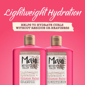 Maui Moisture conditioner applied to curly hair in-hand, shows detangling and softness
